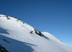 Dal Colle si vede la cima e il pendio che scende nel ghiacciaio del Ruitor